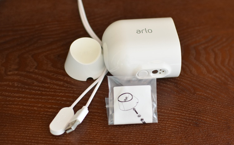 The Arlo Pro 4 magnetic mount and an indoor charging cable